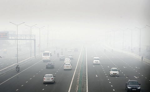 A thick blanket of smog on National Highway 9 in Delhi. (Photo | EPS/Parveen Negi)