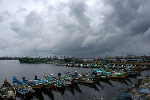Dark clouds loom over the Kasimedu Fishing Harbour on Wednesday Evening .  (Photo |  Ashwin Prasath, EPS)