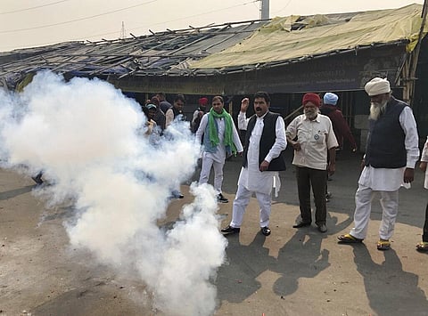 Farmers light firecrackers to celebrate news of the repeal of farm laws they were protesting against, in Ghazipur, on the outskirts of New Delhi, India, Friday, Nov. 19, 2021. (Photo | AP)