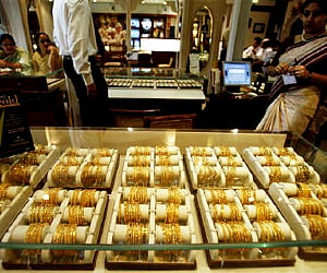 Gold slips Rs 80; silver up Rs 600