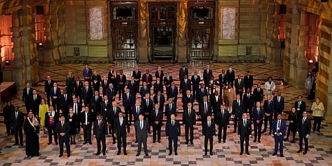 World leaders pose for a group photo during an evening reception to mark the opening day of the COP26 UN Climate Summit, in Glasgow. (Photo| AP)