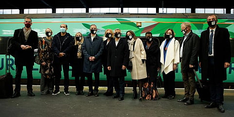 Mayor of London Sadiq Khan (C) poses with a delegation of mayors from other cities beside a train at Euston Station in London. (Photo | AP)