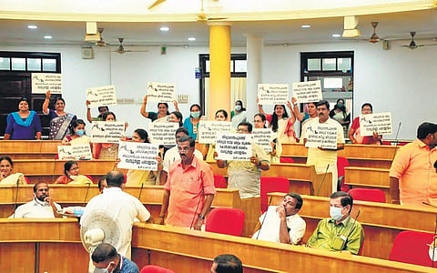 BJP councillors showing placards at the council meeting on Monday as part of preventing stray dog menace in the city | Express
