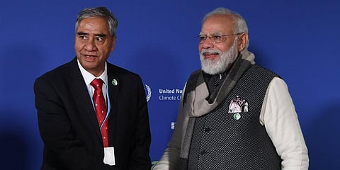 PM Narendra Modi (R) interacts with Nepal PM Sher Bahadur Deuba (Photo | Arindam Bagchi Twitter)