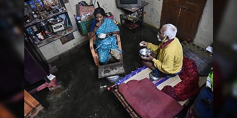 Sundaramurthy and Suguna inside their waterlogged house (EPS Pic I  P Jawahar.)