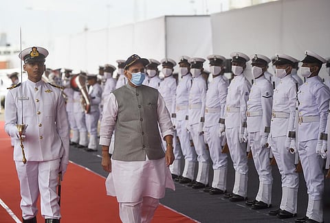 Defence Minister Rajnath Singh inspects a guard of honour on board INS Visakhapatnam, the stealth guided-missile destroyer ships of Project 15B, during it's commissioning ceremony. | PTI