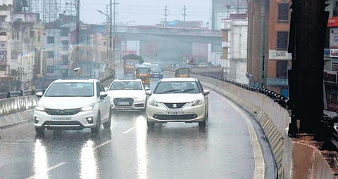 Vehicles move along the Punjagutta flyover amid rains | S Senbagapandiyan