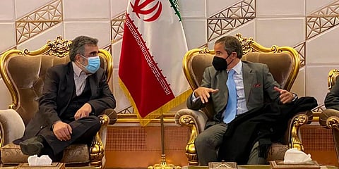 Director General of IAEA, Rafael Mariano Grossi (R) speaks with deputy head of the Atomic Energy Organization of Iran Behrouz Kamalvandi upon his arrival in Iran. (Photo | AP)