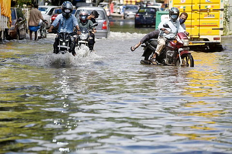 Commuters ride through a waterlogged Sivasailam Street in T Nagar. (Photo | R Satish Babu, EPS)