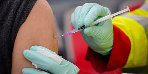 A person is vaccinated with the Pfizer vaccine against the coronavirus. (Photo | AP)
