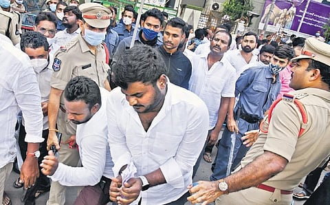 TRS supporters seen tearing up a nomination paper filed by an Independent candidate outside the Rangareddy Collectorate on Tuesday. (Photo| Vinay Madapu, EPS)
