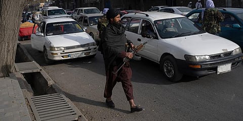Taliban fighters check cars on a street in Kabul , Afghanistan. (Photo | AP)