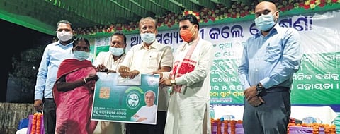 A beneficiary receiving smart health card in Nabarangpur.
