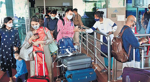 (For representational purposes) Passengers arriving in Ranchi show Covid-19 double vaccination certificates to airport officials on Saturday (Photo | PTI)