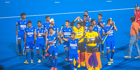 Players of India celebrate after win against Poland during FIH Hockey Men's Junior World Cup at Kalinga Hockey Stadium in Bhubaneswar. (Photo| Biswanath Swain, EPS)