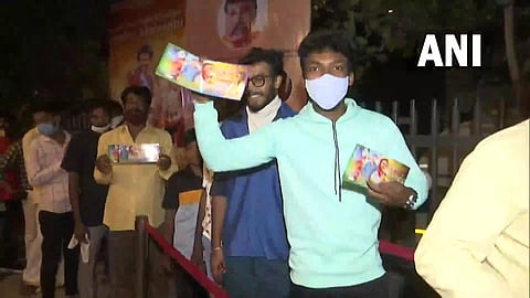 Fans display a ticket of Rajinikanth-starrer Annaatthe in Mumbai. (Photo| ANI)