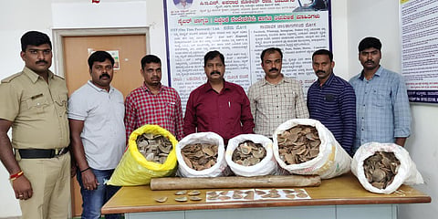 Davangere DCRB police team with the seized pangolin scales. (Photo| EPS)