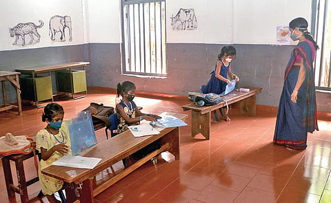 The class teacher gives lessons to students of Class 1 at Government Welfare  LP School at Perambra, Kozhikode, on Wednesday | T P Sooraj