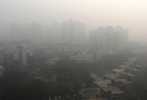 A blanket of dust and haze envelops the city of Gurugram.