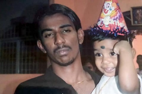This undated photo provided by Sarmila Dharmalingam shows her younger brother Nagaenthran K.Dharmalingam holding his nephew in Ipoh, Malaysia. (Photo | AP)