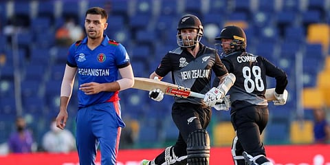 New Zealand captain Kane Williamson and teammate Devon Conway (R) run between the wickets during the Twenty20 World Cup match against Afghanistan in Abu Dhabi, UAE. (Photo | AP)