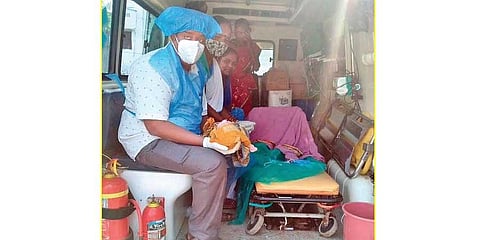 EMT and Asha worker along with the mother and baby | EXPRESS