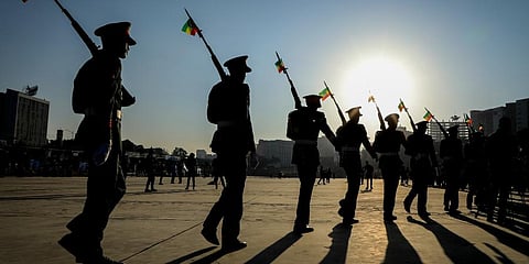 Ethiopian military parade with national flags attached to their rifles at a rally organized by local authorities to show support for the ENDF, at Meskel square in downtown Addis Ababa. (Photo | AP)