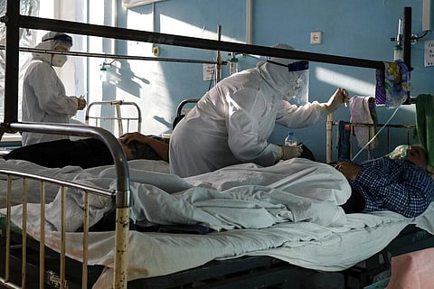 Medics wearing special suits to protect against coronavirus treat patients with coronavirus at an ICU of a hospital in Volgograd, Russia earlier in November. (Photo | AP)