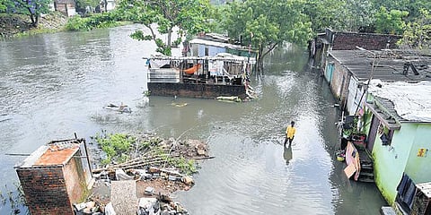Radhakrishnan Nagar flooded with water from the Cooum, in Chennai on Tuesday  | R Satish Babu