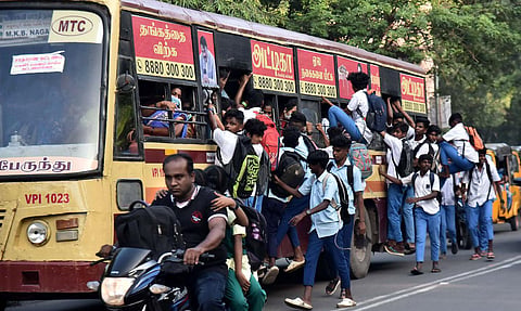School students travelling on footboard at Vepery in Chennai. (Photo | P Jawahar, EPS)
