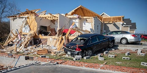 Damaged cars and homes in Bowling Green, Ky. (Photo | AP)