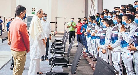 Chief Minister Naveen Patnaik interacting with children during the launch of various sports infra projects at Kalinga Stadium in Bhubaneswar on Thursday, Dec 16, 2021. (Photo I Express)