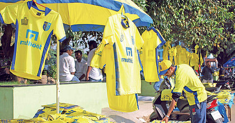 Roadside vendors selling Kerala Blasters FC's yellow kits. (Representational Photo | K Shijith)