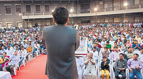 IAS officer Ramesh Gholap, who is still known as ‘Ramu’ in his native Mahagaon village in Solapur, addresses a gathering  | express