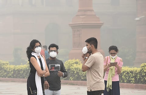 People wear mask to protect themselves from pollution in New Delhi. (Photo | Parveen Negi, EPS)