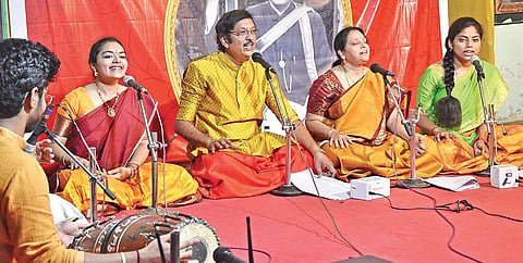 Vocalist Modhumudi Sudhakar along with other singers rendering ‘Sakala Devatha Stuthi’ at Ramakoti in Vijayawada on Sunday | express