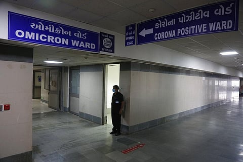 A security guard stands in position outside a ward being prepared for the omicron coronavirus variant at Civil hospital in Ahmedabad. (Photo | AP)