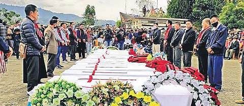 People attend a mass funeral of civilians killed by the Army in a case of mistaken identity, in Mon district of Nagaland on Monday. (Photo | PTI)