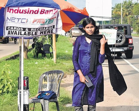 Shehreen Aman selling FASTags near Kumbalam Toll Plaza on the  National Highway 66 | Albin Mathew