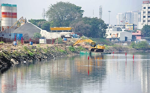 The boundary of the TNHB site in Arumbakkam, marked with red flags, remains submerged  | R Satish Babu