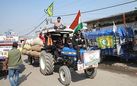 Farmers during the ongoing protest against the new farm laws at Singhu border in New Delhi on Sunday. (Photo | Shekhar Yadav/EPS)
