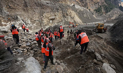 Border Road Organization BRO personnel carry out rescue and restoration work at Raini village in Chamoli. (Photo | Shekhar Yadav, EPS)