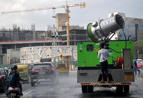 File image of a BBMP van spraying disinfectant near Minsk Square in Bengaluru. (File | EPS)