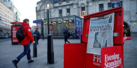 The front page of a newspaper reads that the government is contemplating making it compulsory that all visitors to the UK will have to quarantine in a hotel, after arriving. (File photo| AFP)