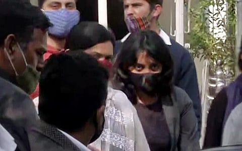 Activist Disha Ravi (in black mask) sent to 5 days Delhi police special cell custody, in New Delhi on Feb 14. (Photo | ANI)