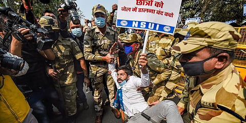 Police detain NSUI activists who were staging a protest against the arrest of climate activist Disha Ravi, in New Delhi (Photo | PTI)