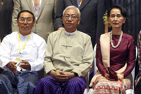Myanmar's Vice President Myint Swe, left, sits with State Counsellor Aung San Suu Kyi, right, and then President Htin Kyaw, pose for a photo session. (Photo | AP)