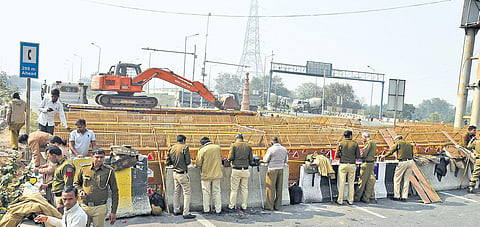 Barricades being strengthened near Akshardham to stop farmers from marching towards the national capital to protest against the farm reform laws, in New Delhi. (Photo  Parveen Negi, EPS
