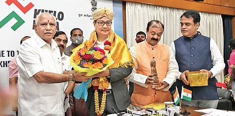 Chief Minister B S Yediyurappa honouring Union Sports Minister Kiren Rijiju  during a meeting on Khelo India University Games, in Bengaluru on Sunday