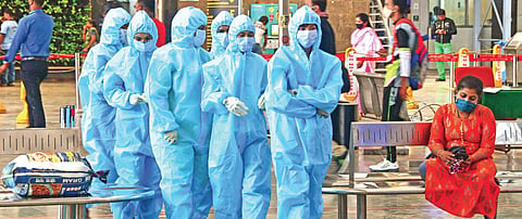 Healthcare workers arrive at CSMT railway station to screen passengers following the surge in Covid-19 cases in Mumbai. (Photo | PTI)